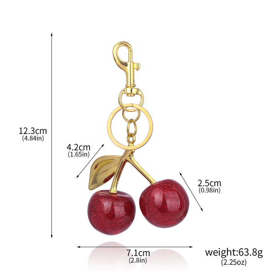 Red cherry keychain with gold leaf and size markings