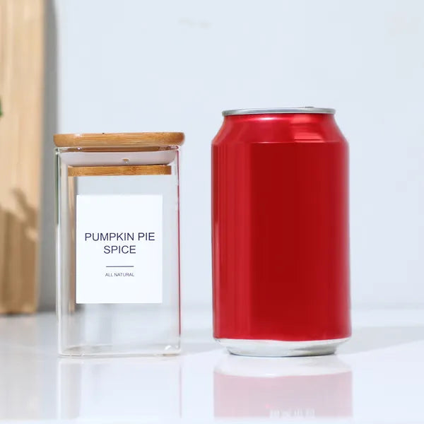 Labeled spice jar beside a soda can for size
