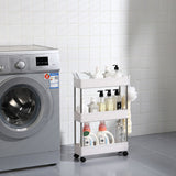 Slim rolling storage cart shown between appliances