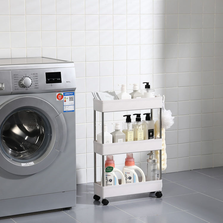 Slim rolling storage cart shown between appliances