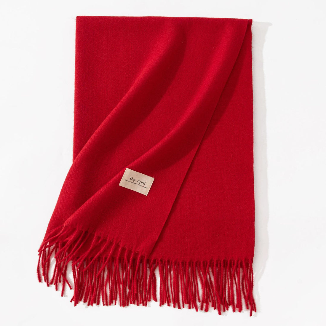 Red faux cashmere scarf with tassels, folded