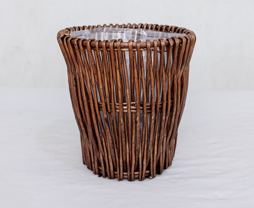 Brown woven willow planter basket with plastic liner