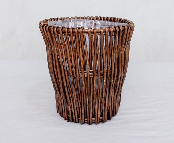 Brown woven willow planter basket with plastic liner