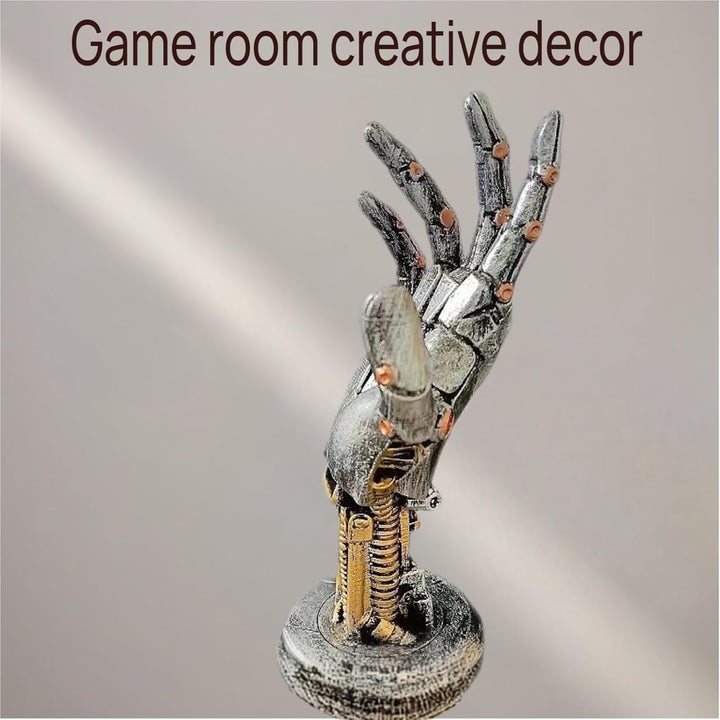 Silver mechanical hand cradling a game controller