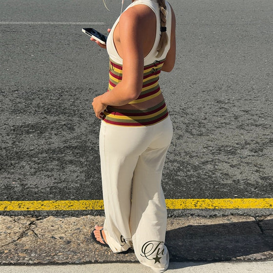 Back view of the striped crop top and flared pants
