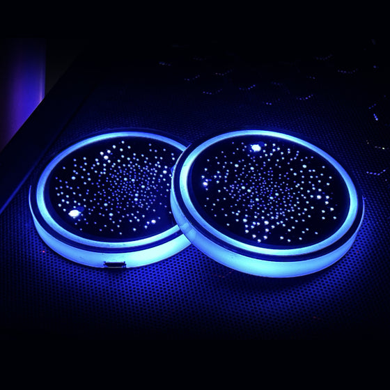 Pair of starry sky LED coasters glowing blue