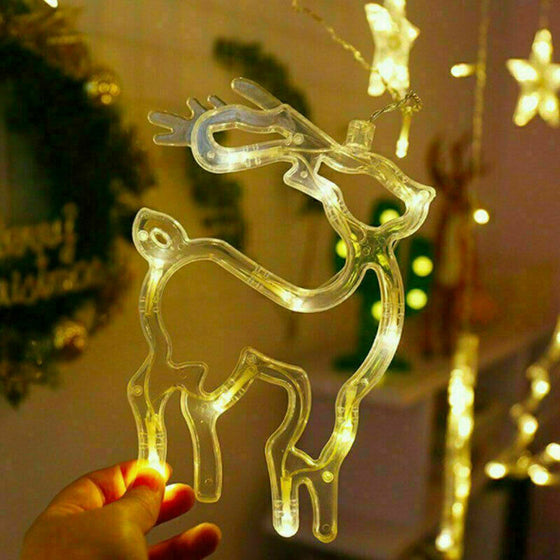 Close-up of a warm white LED reindeer shape on the curtain lights