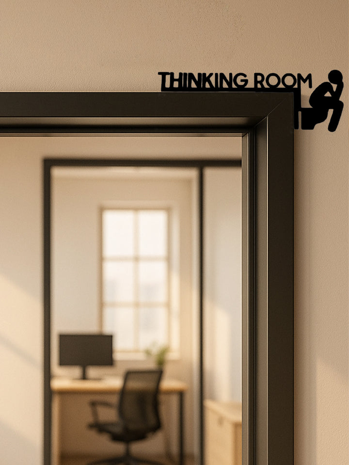 Modern metal toilet door sign mounted on bathroom door