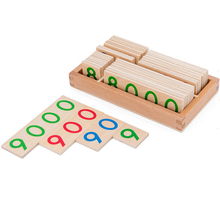 Child using the wooden number cards