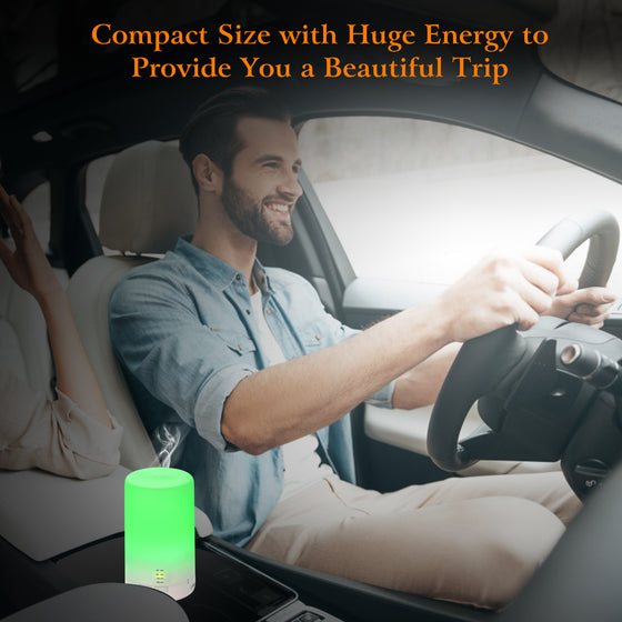 Man driving with a mini humidifier glowing green in the car
