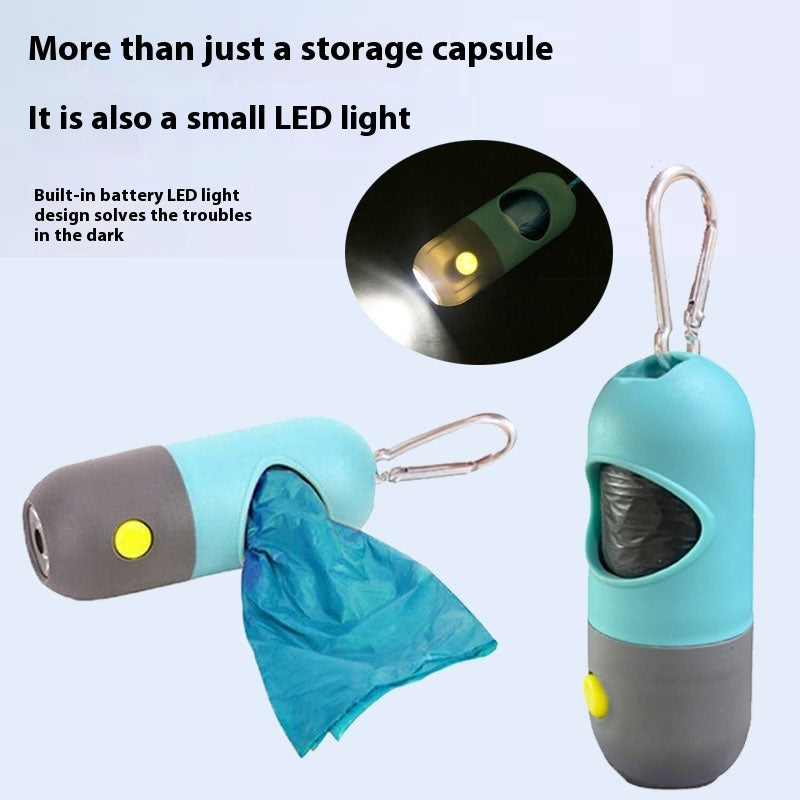 Teal poop bag dispenser with LED light on and a bag pulled out