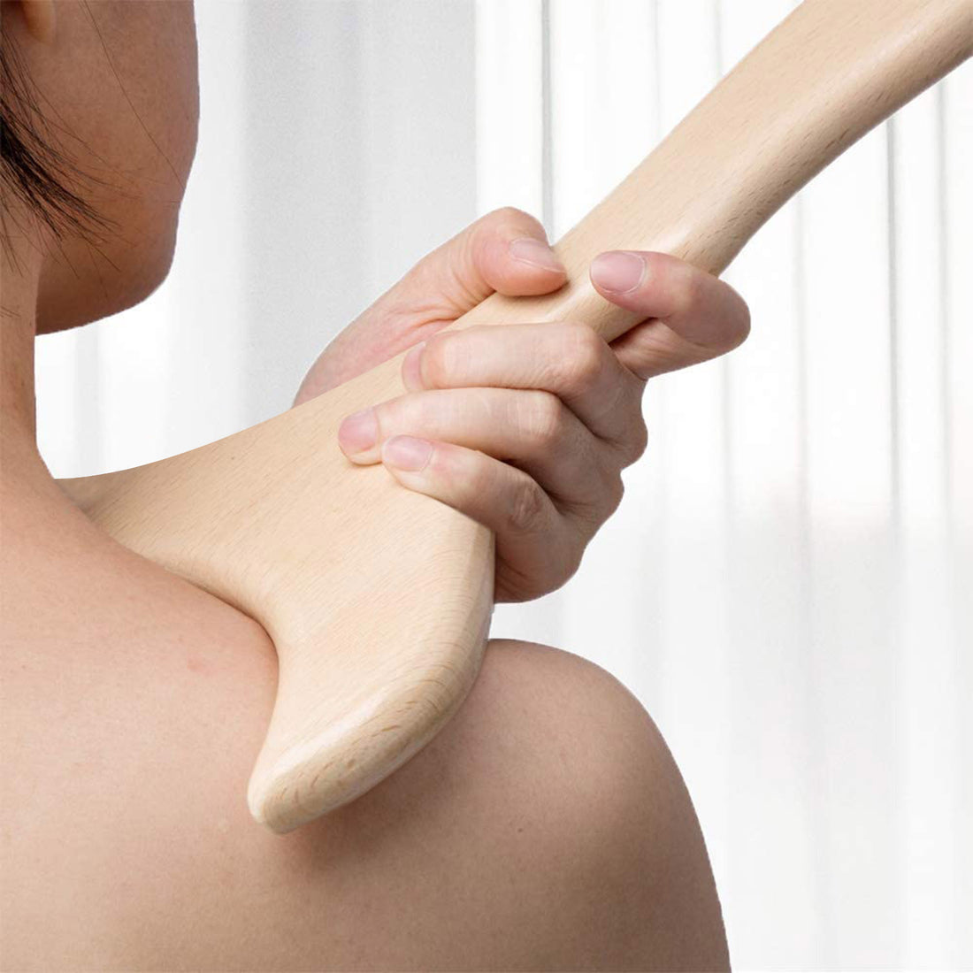 Wood therapy massage tool for body sculpting on a clean surface