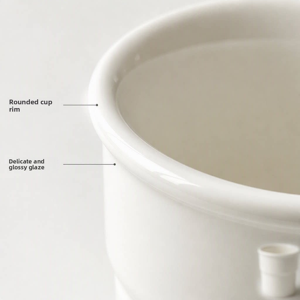 Hand holding a white ceramic cup