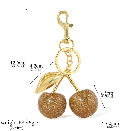 Champagne glitter cherry keychain with gold leaf and size markings