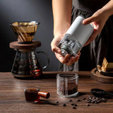 Portable USB coffee grinder standing upright