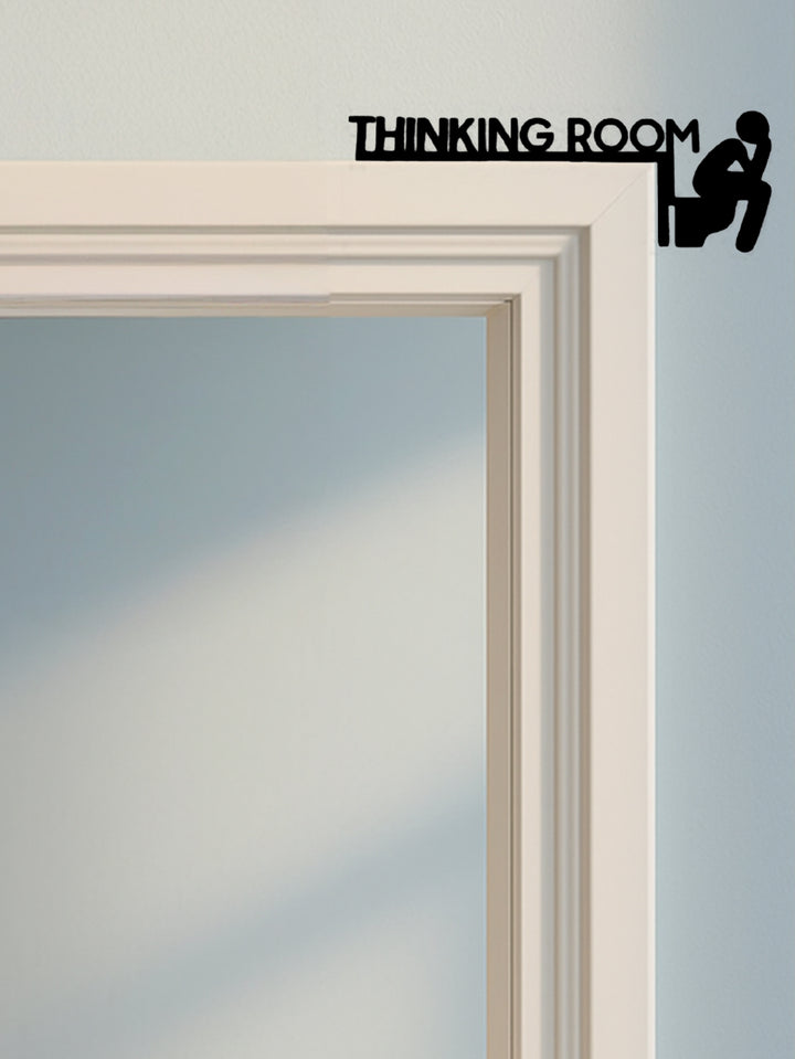 Toilet door sign mounted at hallway entrance