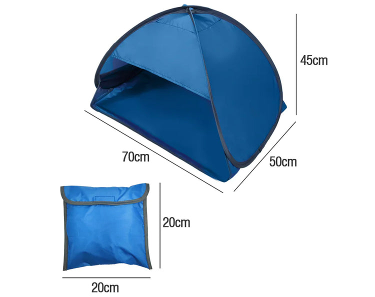 Pop-up beach tent open on sand