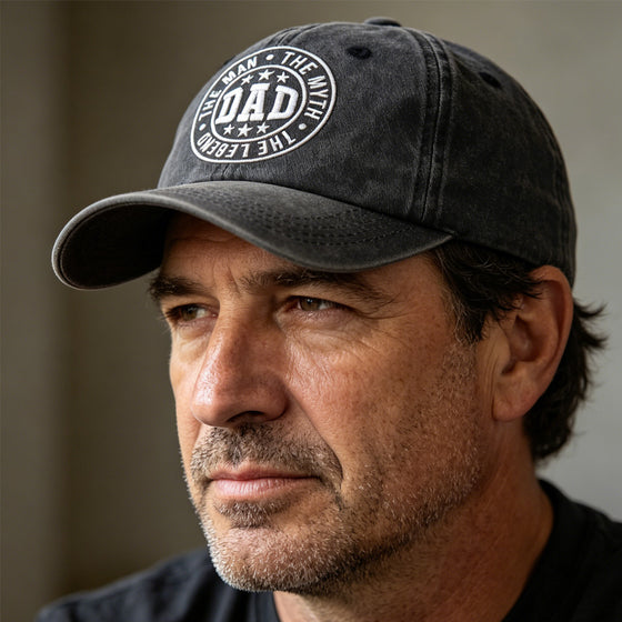 Man in a black DAD The Man The Myth The Legend embroidered cap, side angle