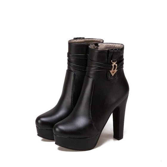 Black platform ankle boot with a block heel and side zipper
