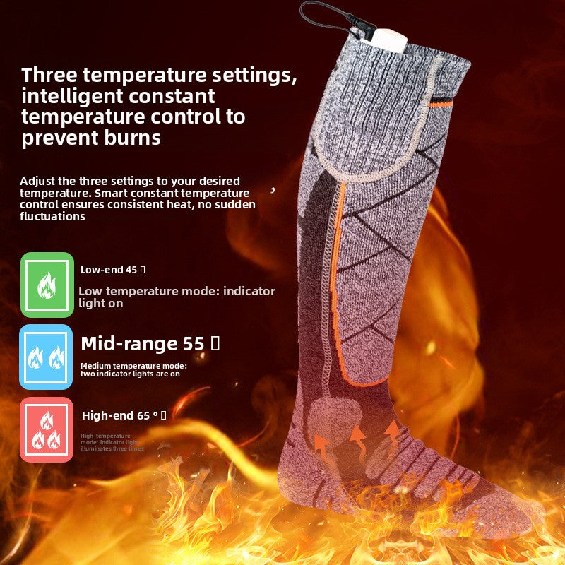 Orange and pink rechargeable electric heated socks with battery pack, photo 1