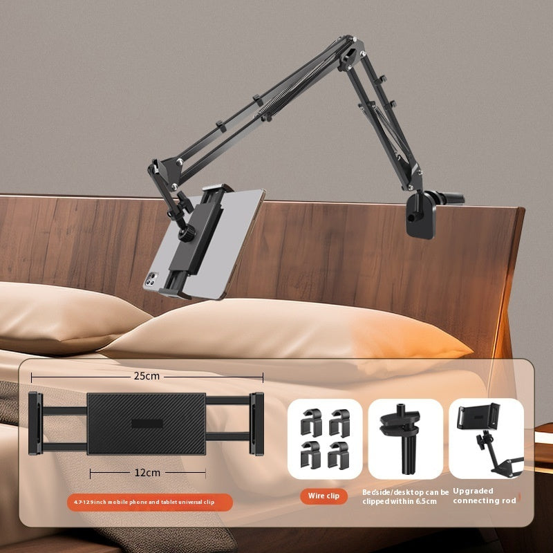 Stand shown next to a lamp and alarm clock to show typical bedside placement