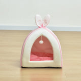 Cat peeking out from inside the bunny house