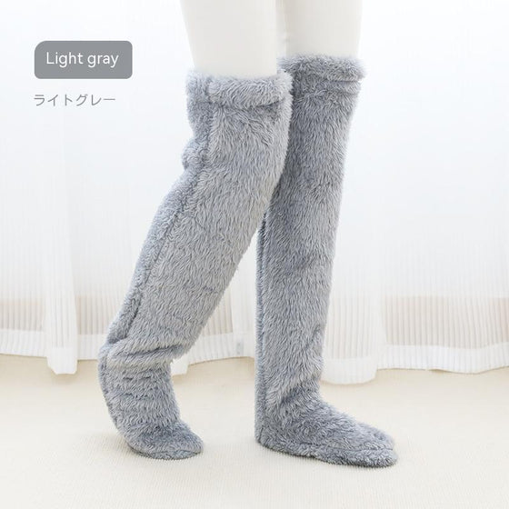 Silver gray over-the-knee fuzzy socks worn standing
