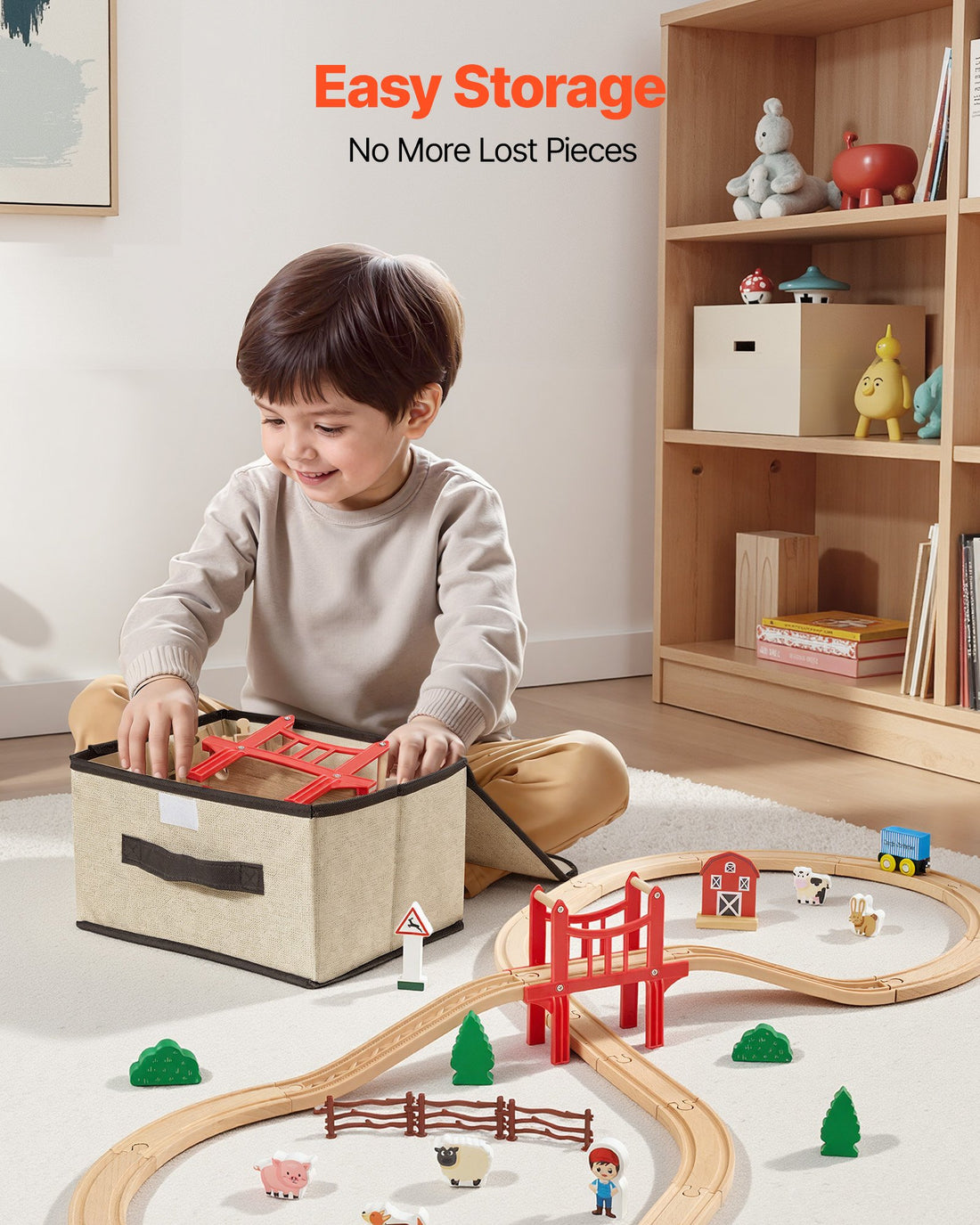 Boy building the wooden train track next to its fabric storage box