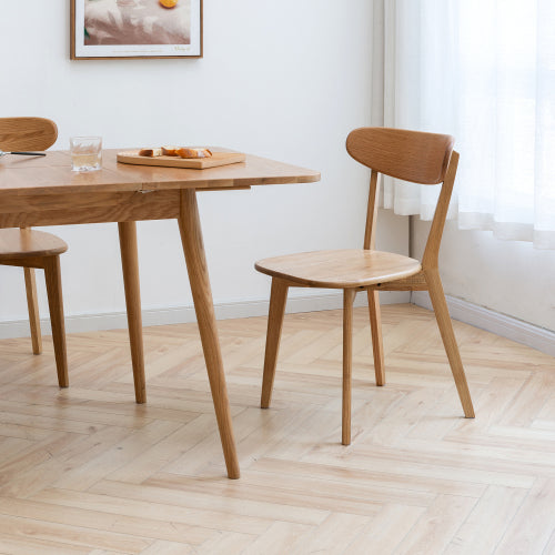 Wood dining chairs styled in a modern dining room