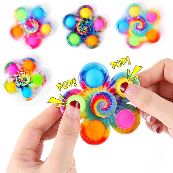 Hand pressing the pop bubbles on rainbow five-leaf fidget spinners, 4-pack
