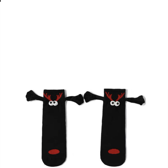 Black reindeer socks with red noses holding hands with magnetic arms