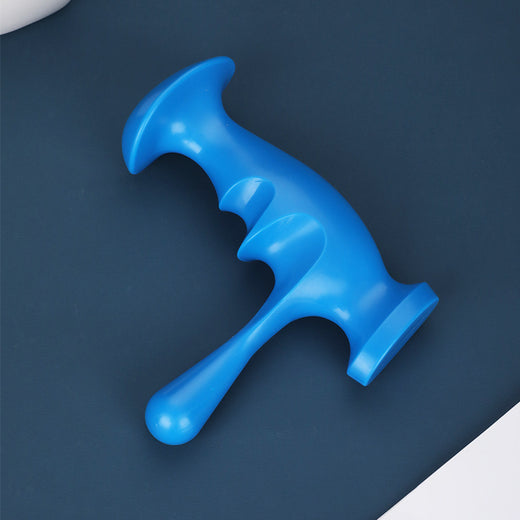 Manual trigger point massager, held in hand