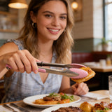 Stainless steel kitchen tongs gripping food