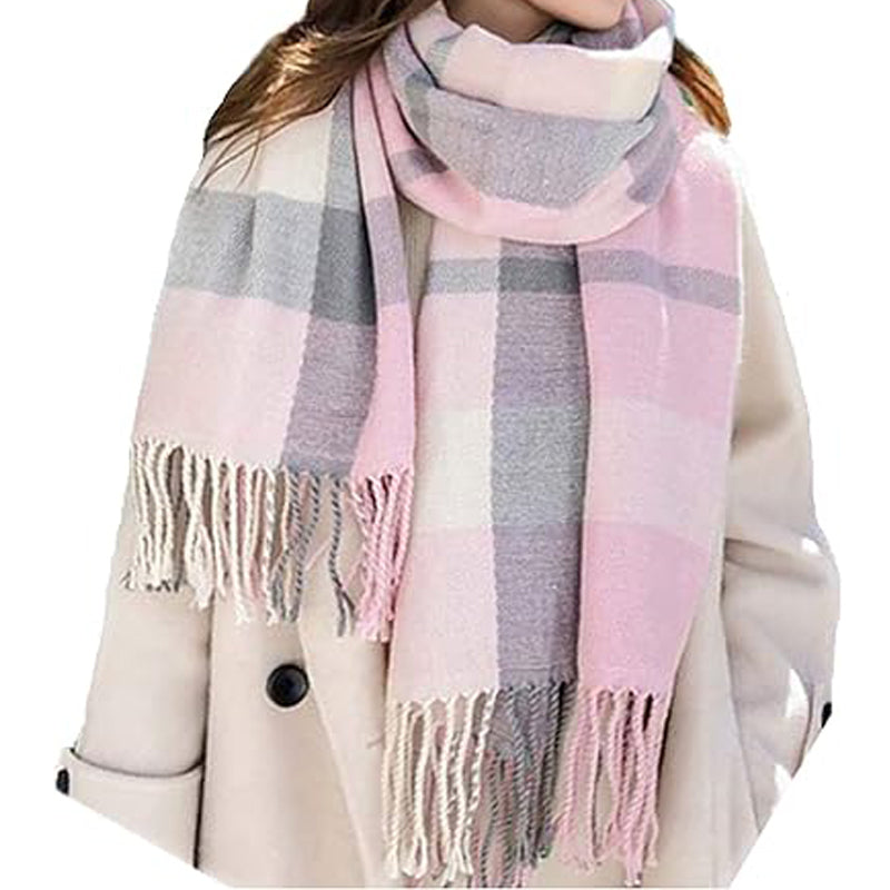 Woman in a beige coat wearing the pink plaid tassel scarf
