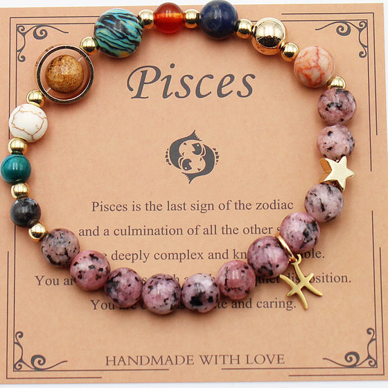 Pisces zodiac bracelet with pink beads on its card
