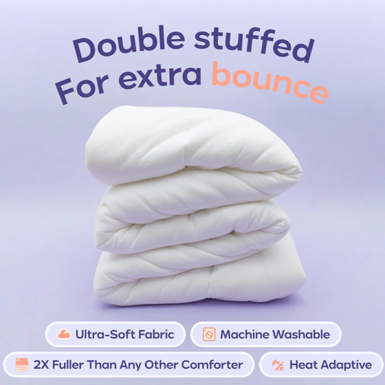 Stack of a white double-stuffed comforter on a lilac background