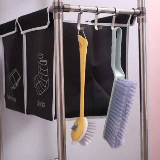Brushes hanging from the laundry sorter hooks