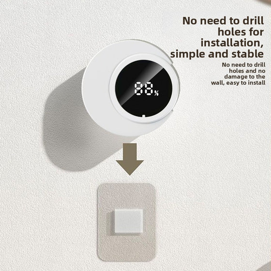 Round white toothbrush sanitizer with an 88% display and an adhesive pad