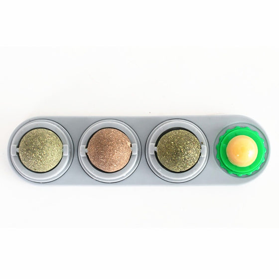 Gray catnip wall toy holder mounted horizontally with four balls
