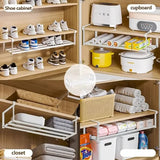 Iron shoe rack loaded with sneakers and boots