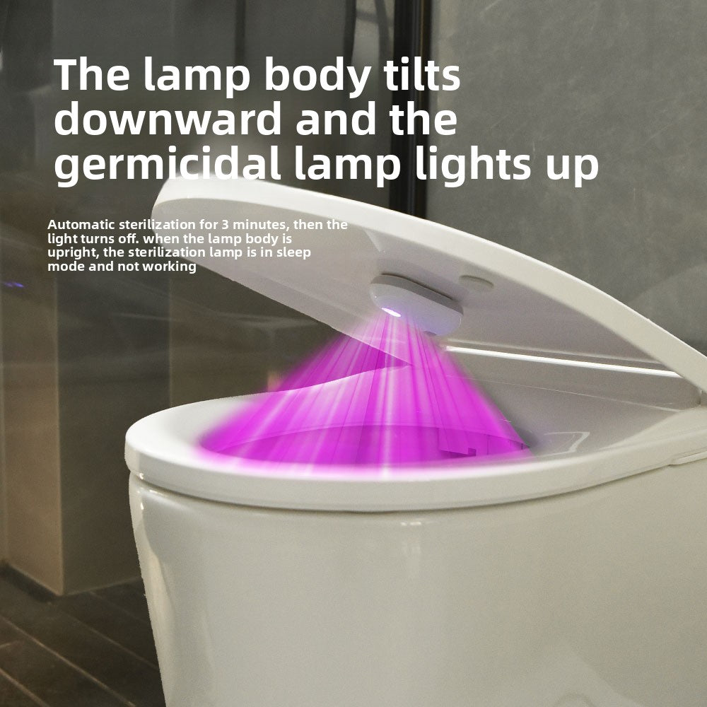 Toilet bowl lit by a purple germicidal lamp from a sensor lid light