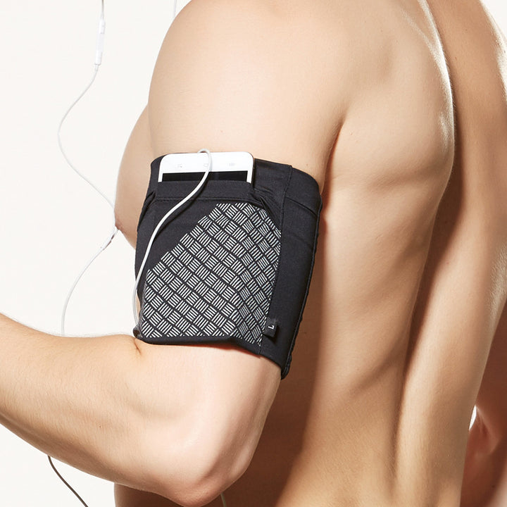 Armband shown flat to display its stretch fabric construction