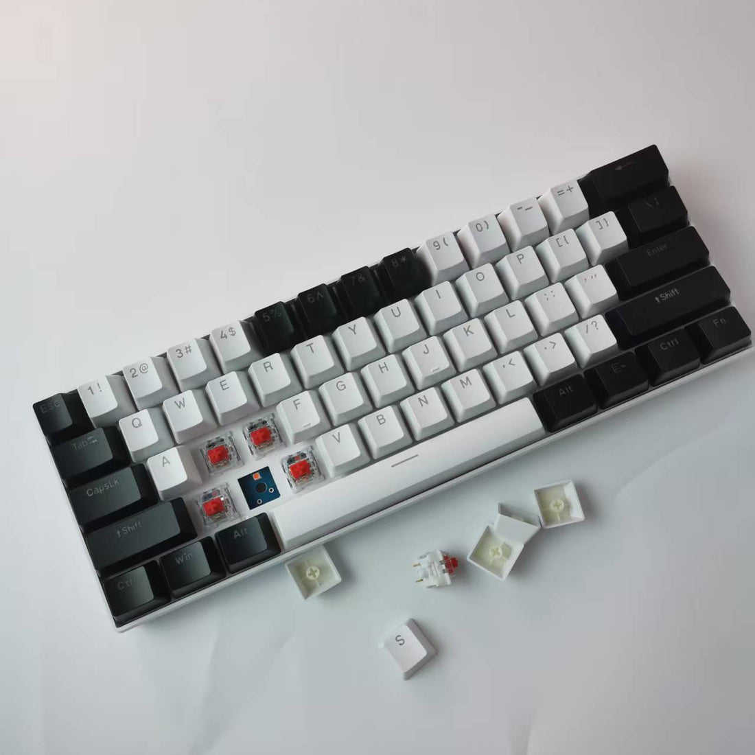 Two-tone black and white mechanical keyboard with exposed switches