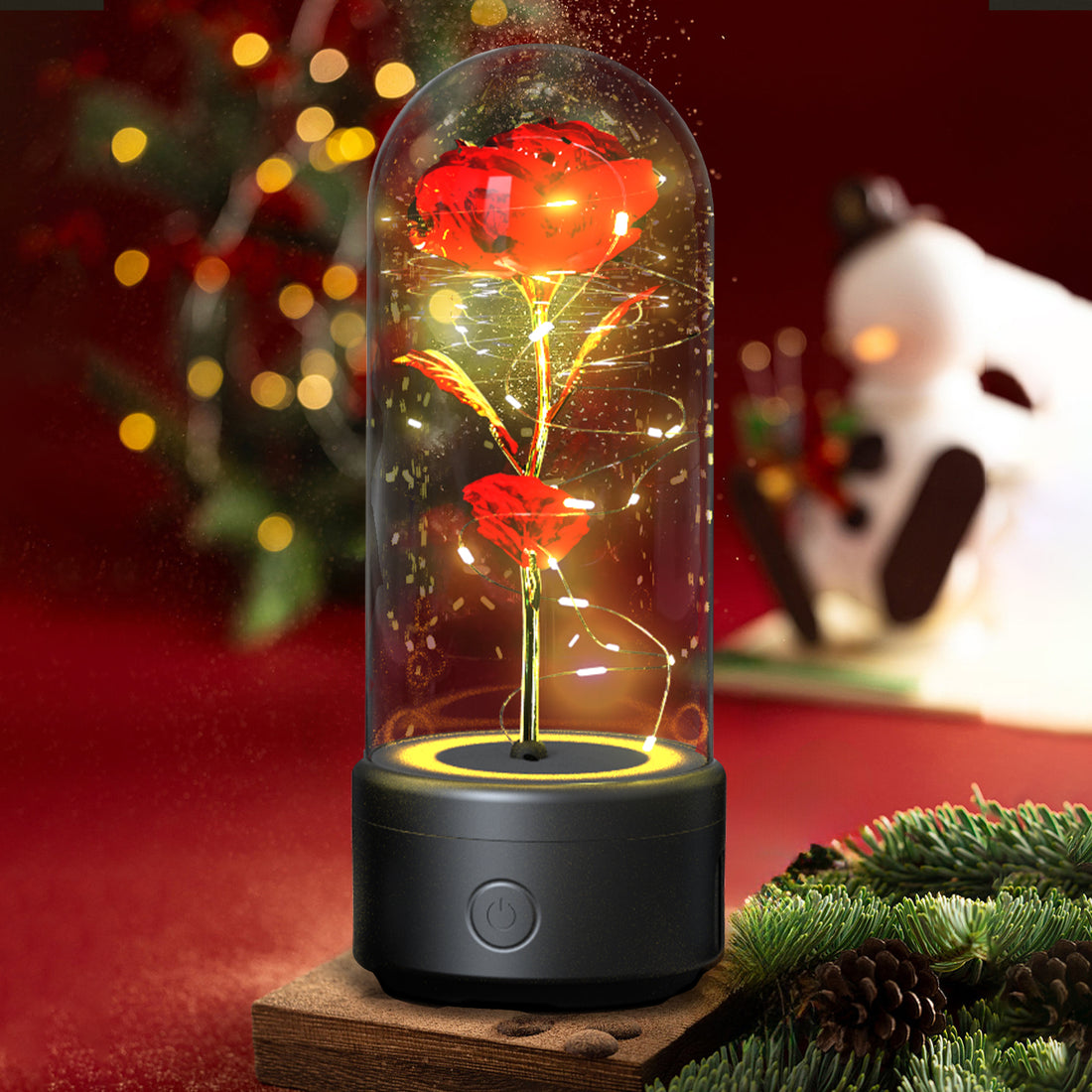Red rose LED lamp in a glass dome on a black Bluetooth speaker base