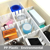 Drawer dividers organizing kitchen utensils