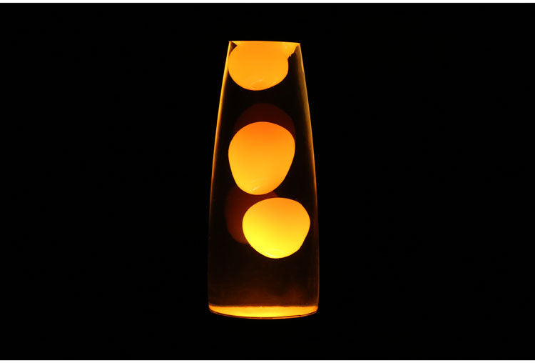 Orange wax motion lamp glowing in the dark