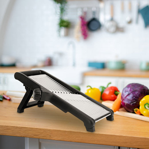 Mandoline slicer hand guard in use