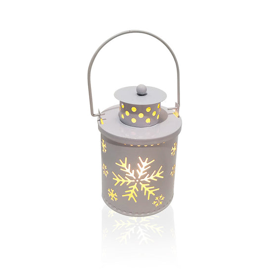 White Christmas LED candle lantern with snowflake cutouts on a white background