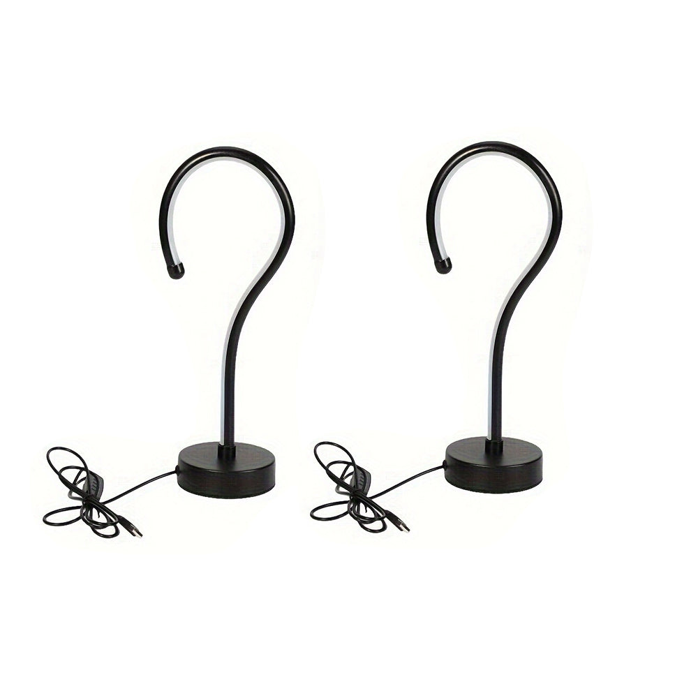 Two black question mark lamps with USB cables on a white background