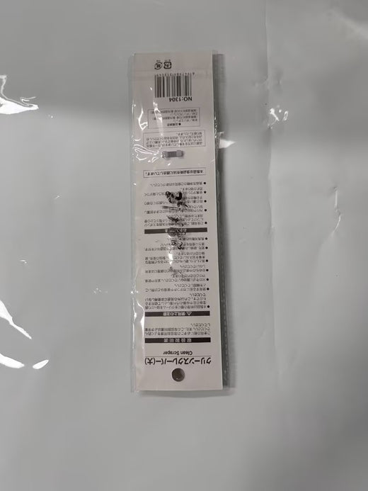 Oversized silicone spatula spreading butter in pan